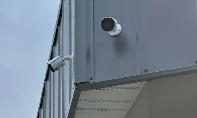 Exterior security cameras mounted on a building