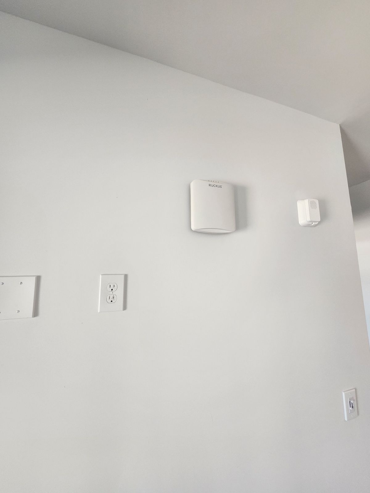 Wall-mounted Ruckus Wi-Fi access point installed for the 124-room Mauldin apartment project