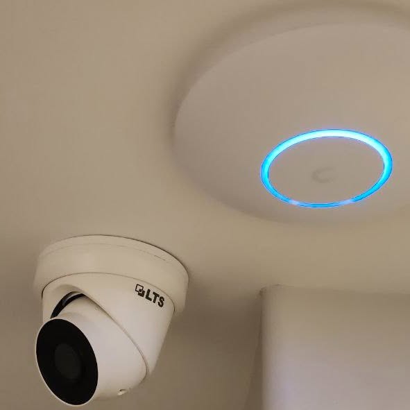 LTS security camera and UniFi Wi-Fi 7 access point installed near each other at a Spartanburg church