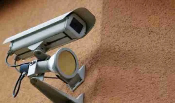 Wall-mounted security camera with two floodlights