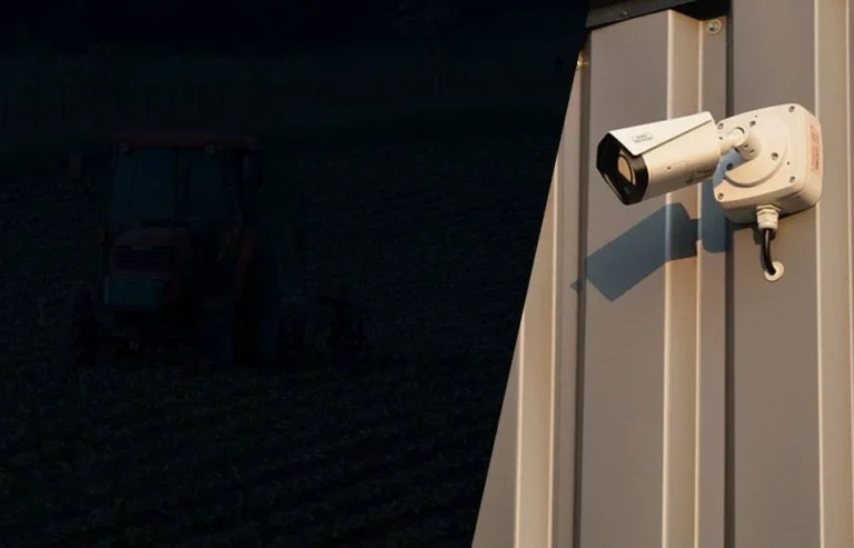 Outdoor security camera mounted on a metal-sided building at night