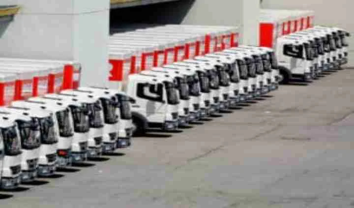 Rows of trucks parked outside a fleet depot